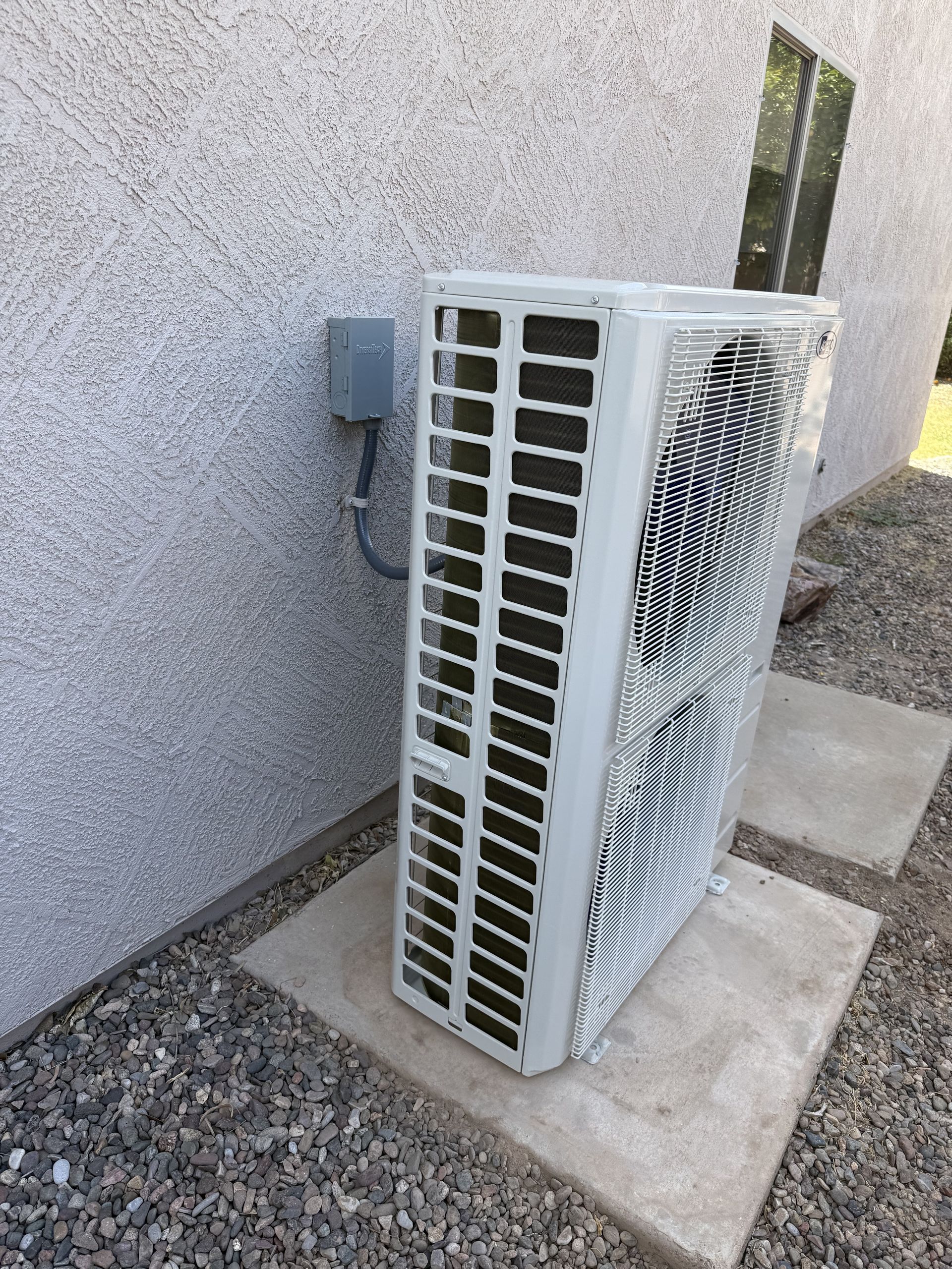 Outdoor AC installation beside an Arizona home